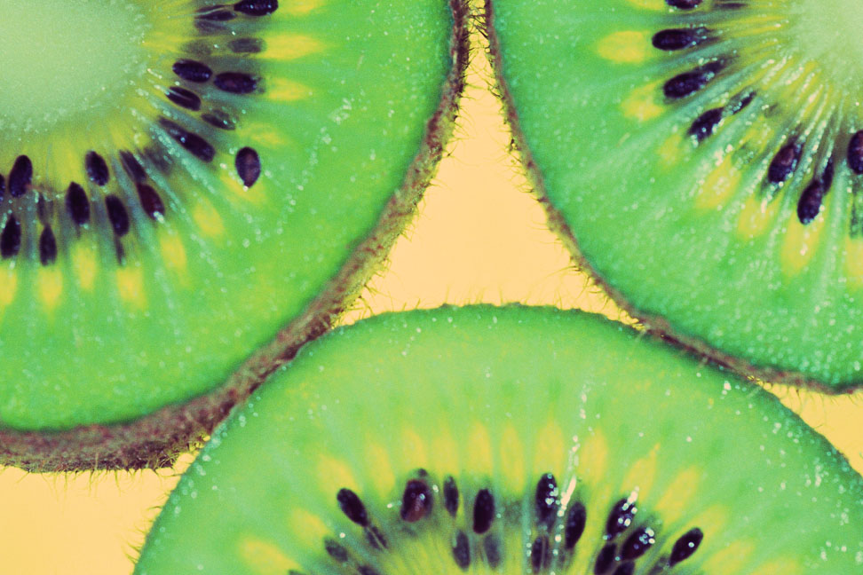 Slices of kiwi fruit	Color Image, Horizontal, Full Frame, Image Lighting, Back Lit, Photography, Nobody, Close-up, Detail, Day, Indoors, Studio Shot, Freshness, Food And Drink, Healthy Eating, Backgrounds, Food, Slice, Seed, Cross Section, Pattern, Green, Fresh Food, Fruit, Tropical Fruit, Kiwi, Wet, Small Group of Objects, Three Objects	EyeWire Collection