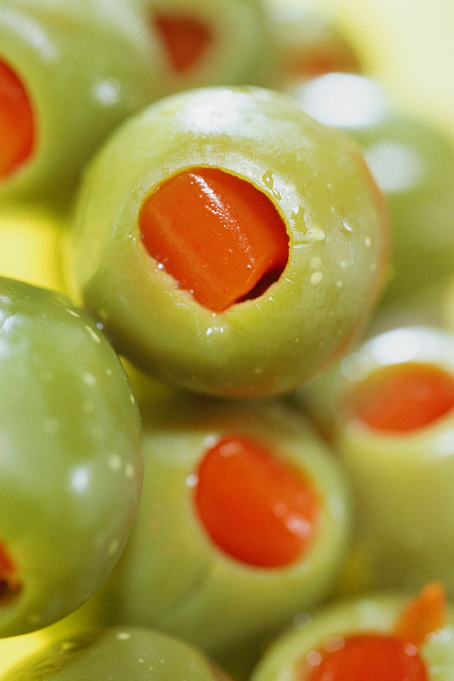 Spanish olives stuffed with pimento	Color Image, Vertical, Full Frame, Photography, Nobody, Close-up, Day, Studio Shot, Indoors, Backgrounds, Food And Drink, Smooth, Vegetable, Pepper, Pimento, Green, Stuffed, Fruit, Olive, Green Olive, Medium Group of Objects	EyeWire Collection